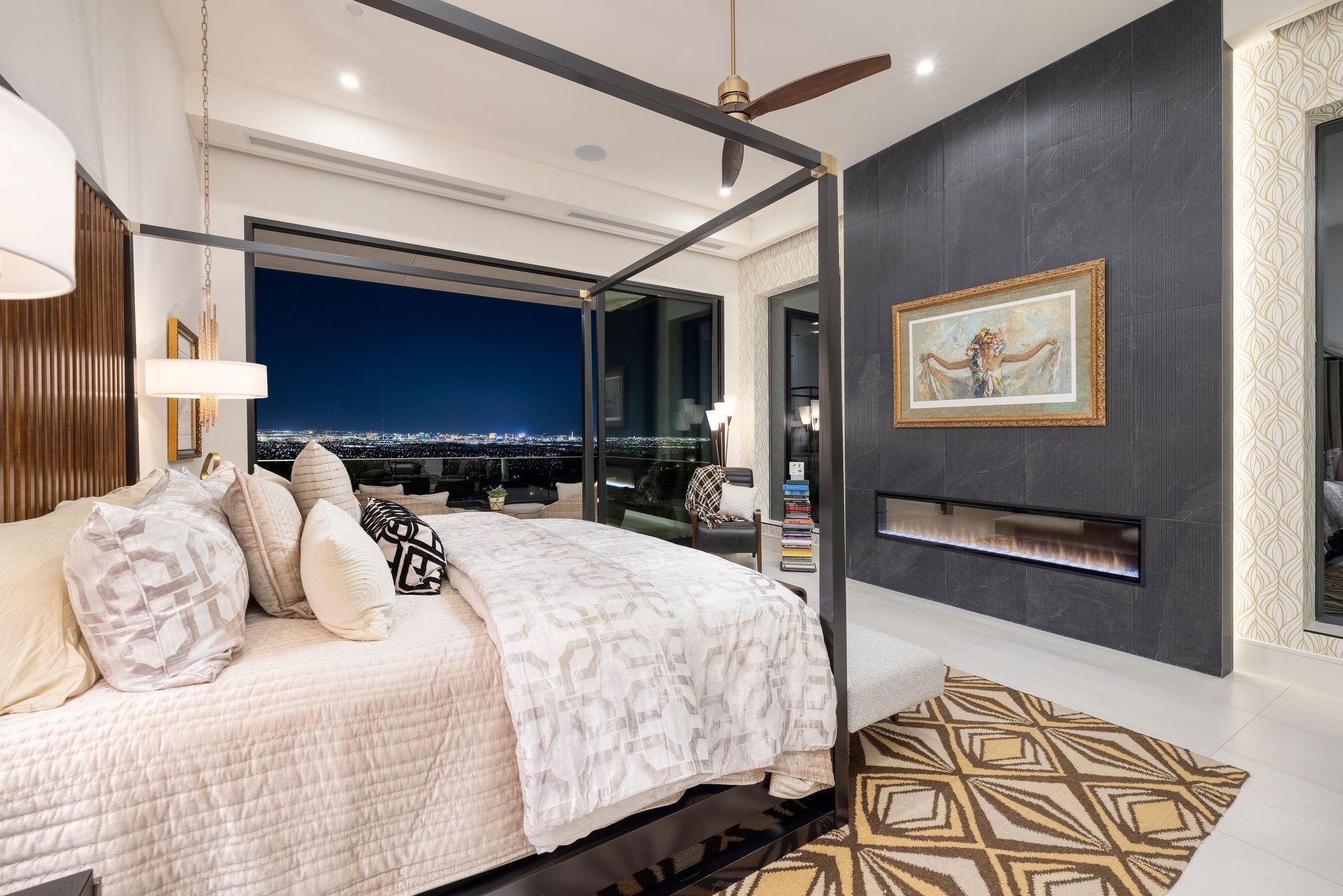 a bedroom with a four poster bed and a fireplace