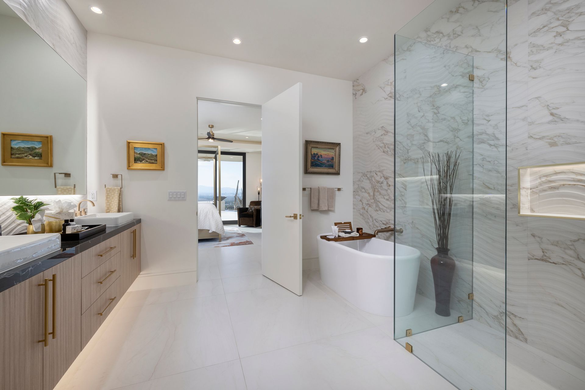 a bathroom with a glass shower and tub