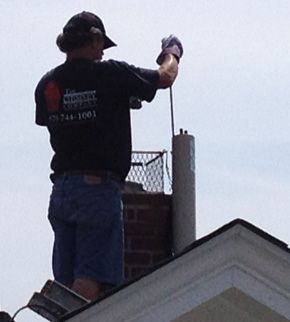 Man doing Chimney Cleaning