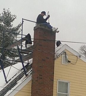 Man cleaning Chimney