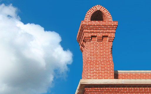 Brick chimney with the sky in the background