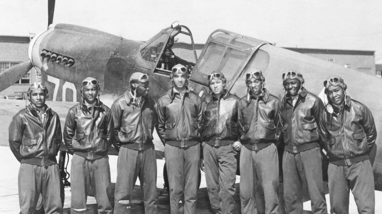 Tuskegee Airmen in Front of a P-40 Fighter Aircraft