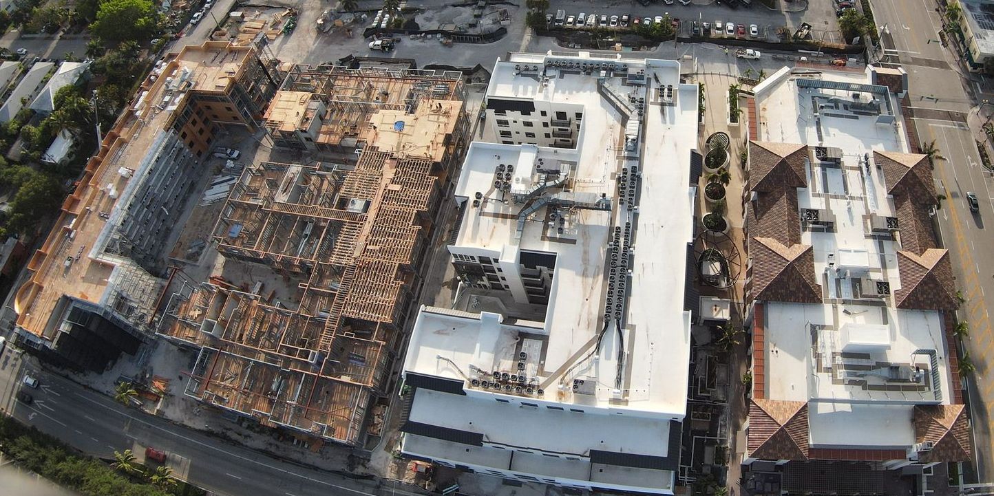 An aerial view of a large building under construction