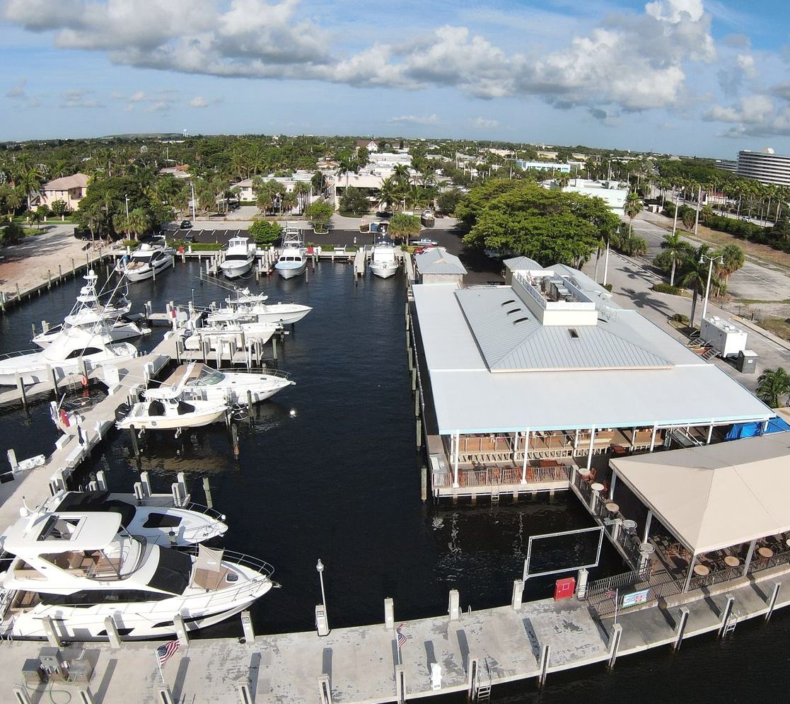 An aerial view of a marina with many boats docked