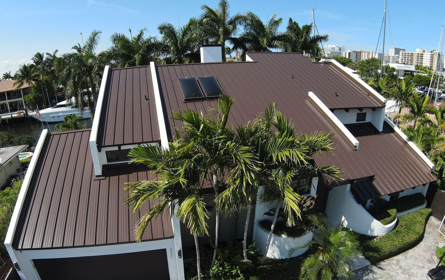 An aerial view of a house with a brown roof