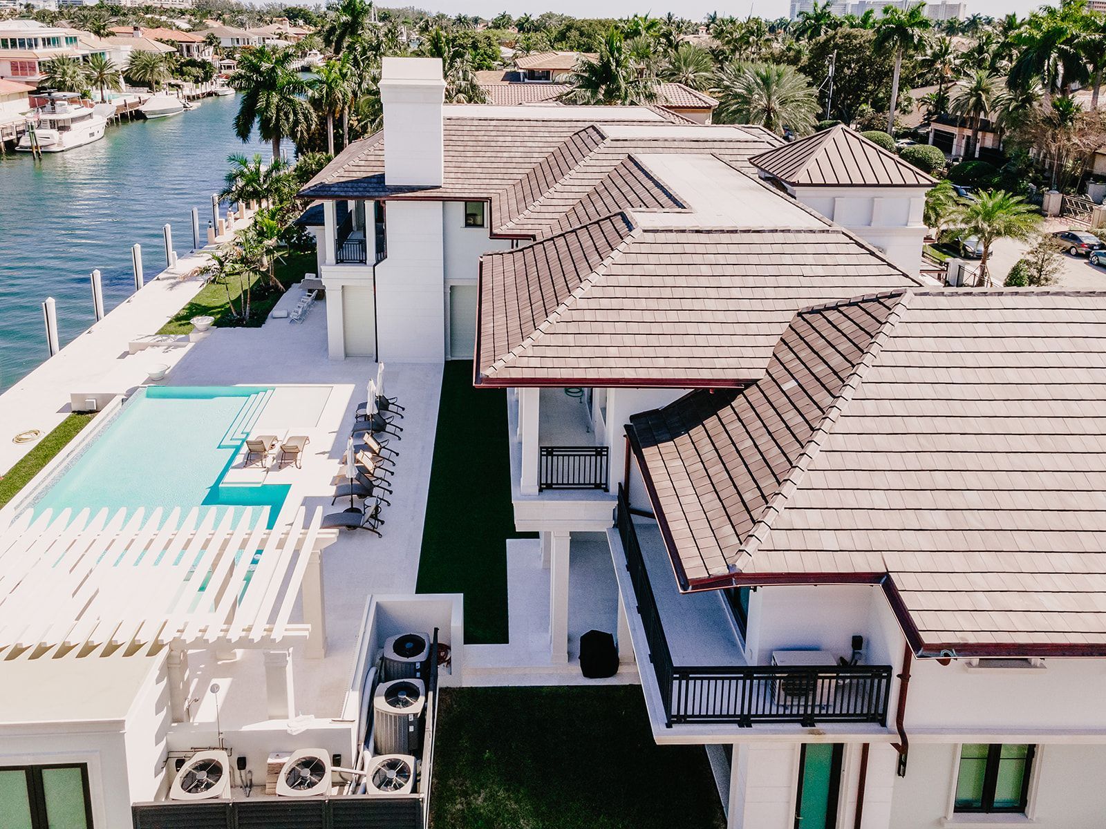 An aerial view of a large house with a swimming pool.