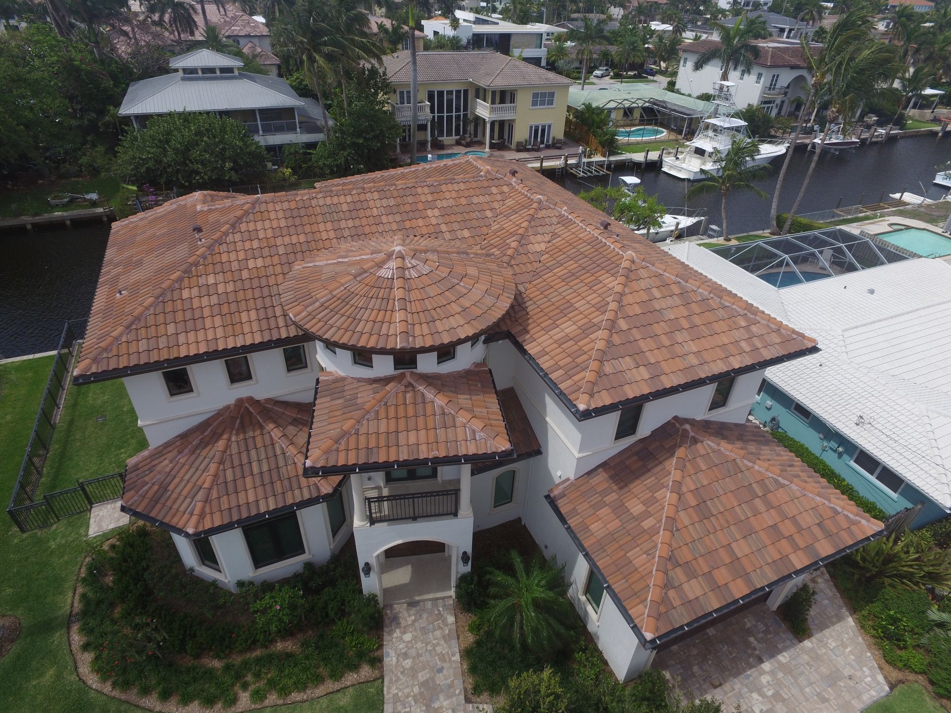 An aerial view of a large house with a tiled roof.