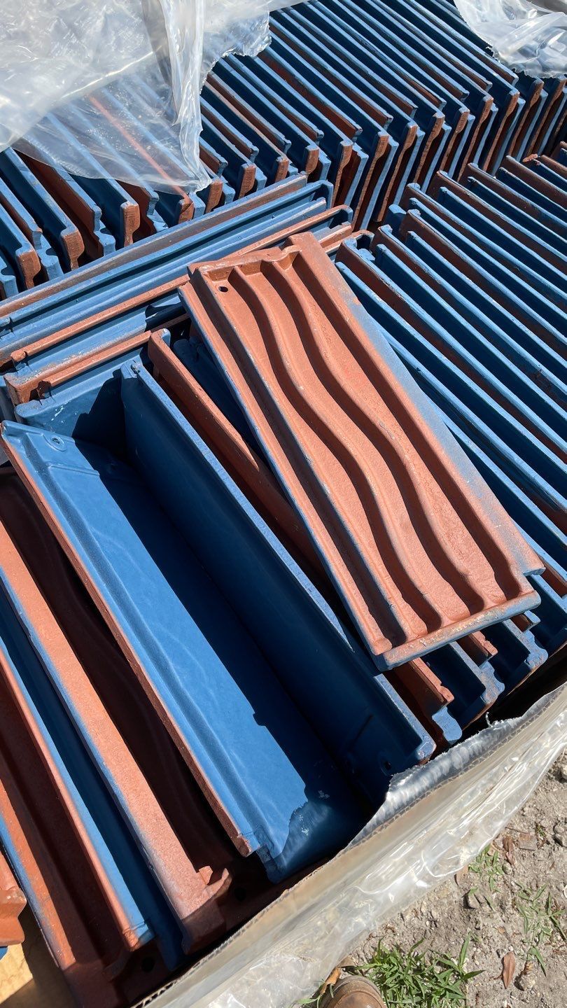 A bunch of blue and red tiles are stacked on top of each other.