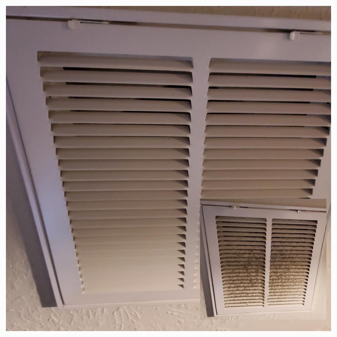 White air vent with removable filter showing dust and dirt.