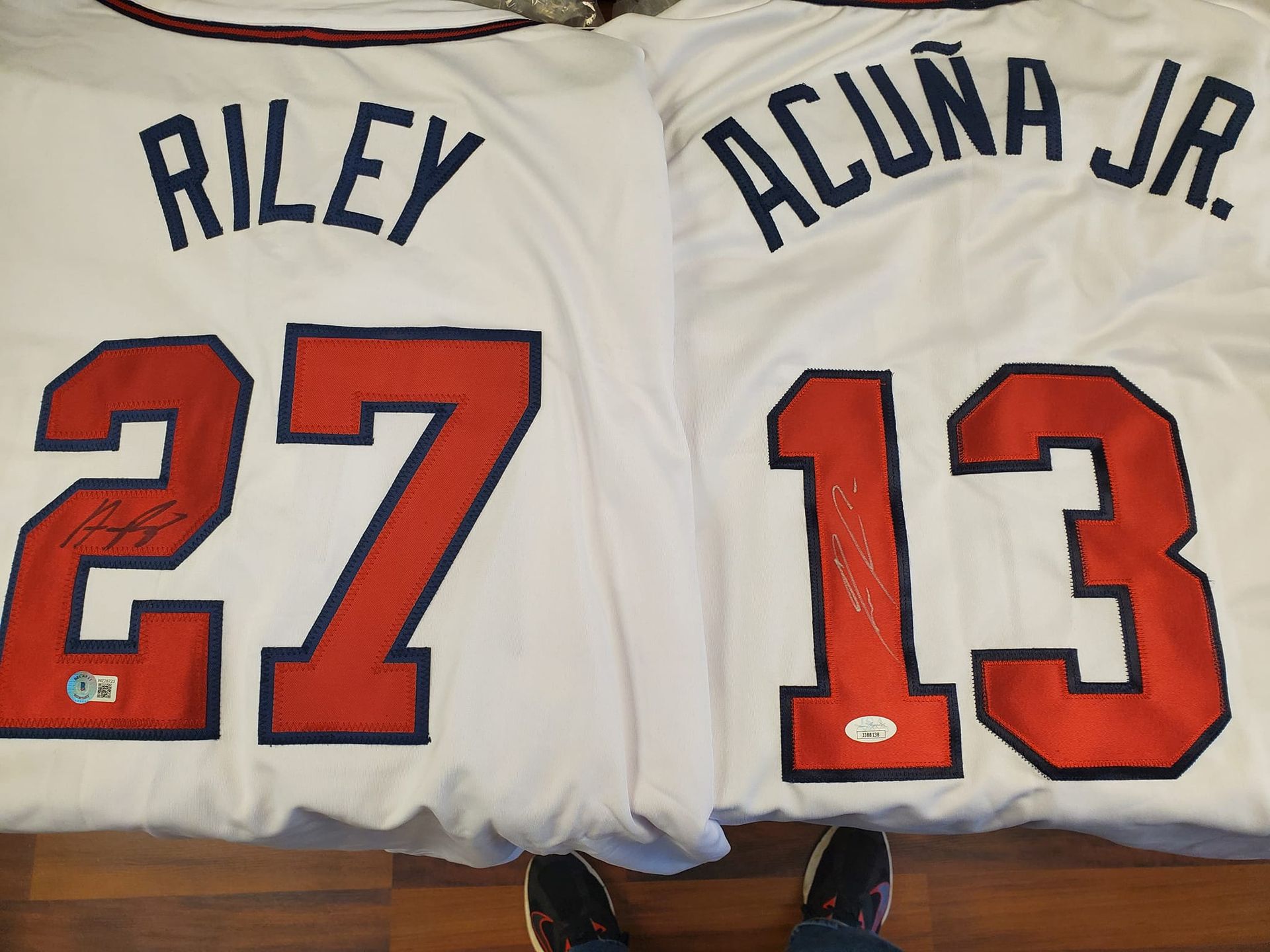 Two jerseys with the names riley and acuna on them