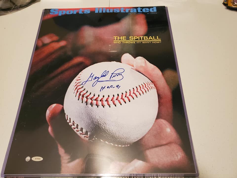 A sports illustrated magazine with a baseball on the cover