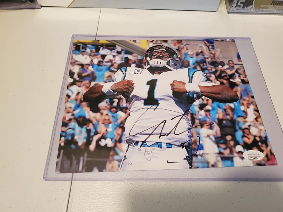 A signed photo of carolina panthers quarterback cam newton