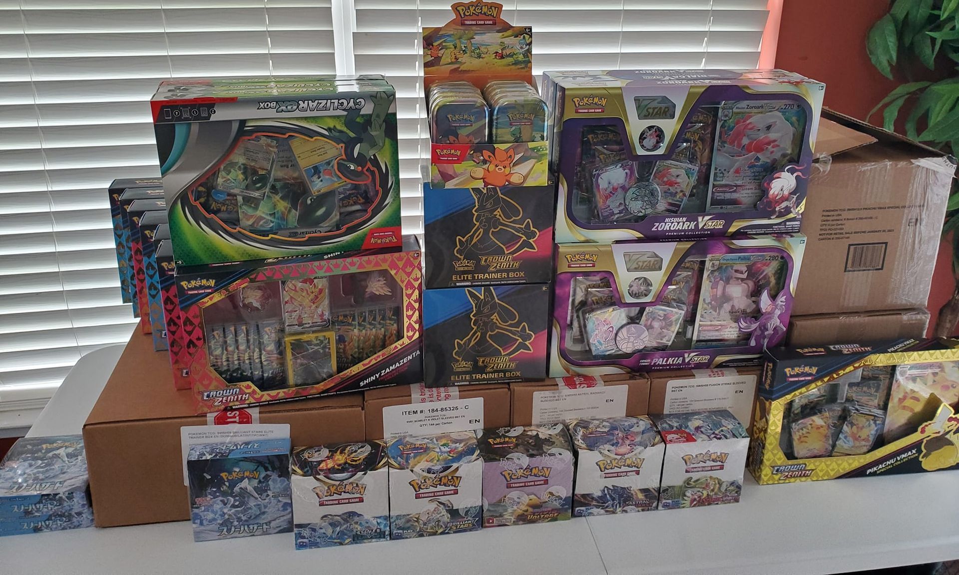 A bunch of toys are stacked on top of each other on a table.