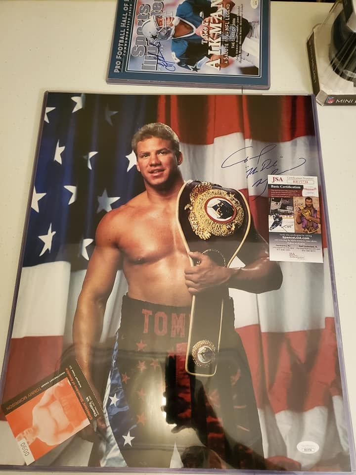 A poster of a boxer with the word tom on his shorts