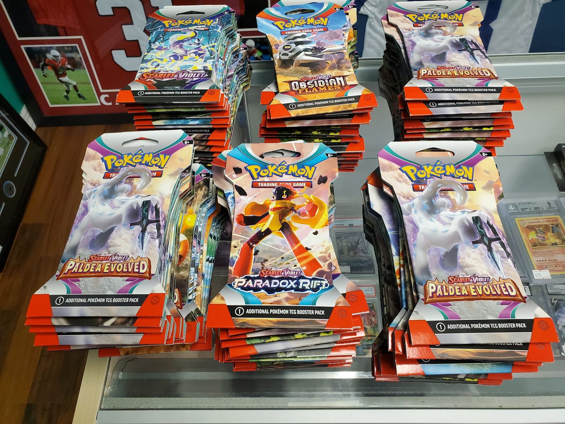 A bunch of pokemon cards are stacked on top of each other