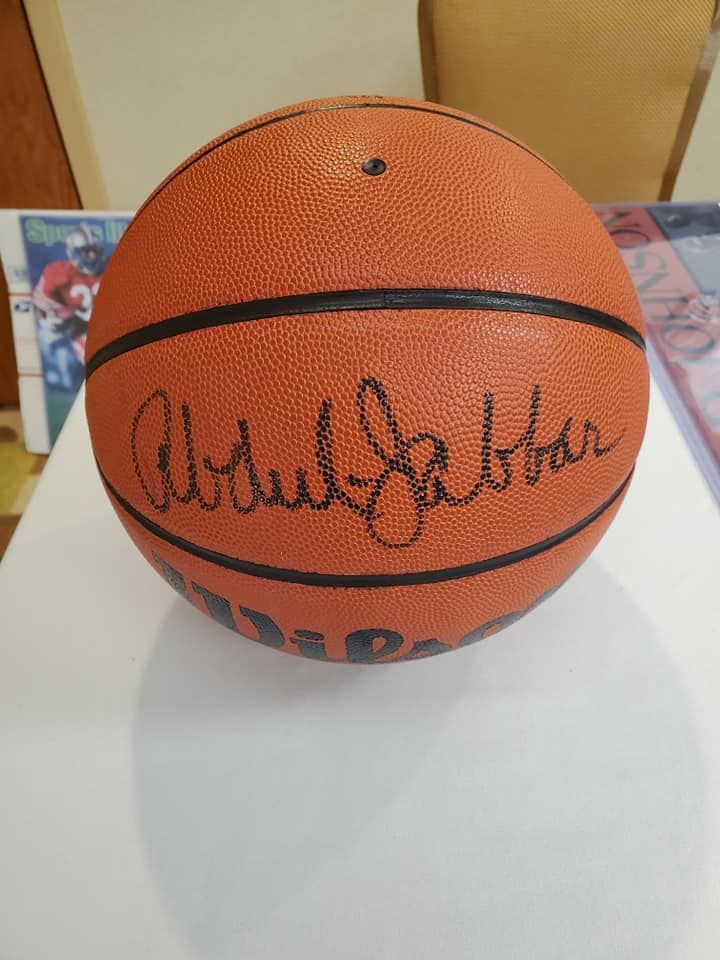 A signed basketball with the name abdul jabbar on it