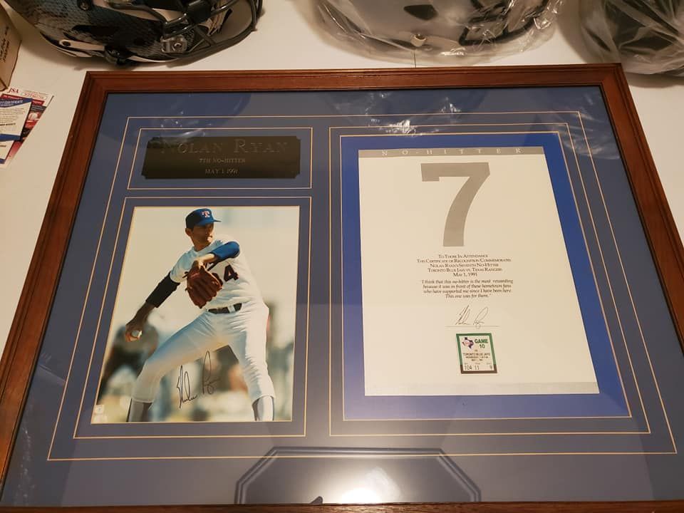 A framed picture of a baseball player with the number 7 on it