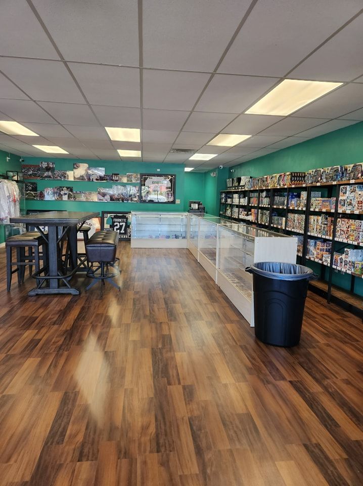 A store with wooden floors and a trash can in the middle