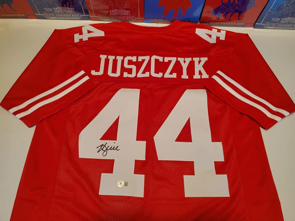 A red jersey with the number 44 on it
