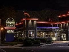 A buffalo wild wings restaurant is lit up at night.