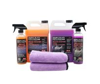 A group of bottles and towels sitting next to each other on a table.