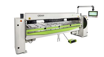 A white and green machine with a monitor on top of it.