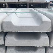 A close up of a pile of concrete blocks stacked on top of each other.