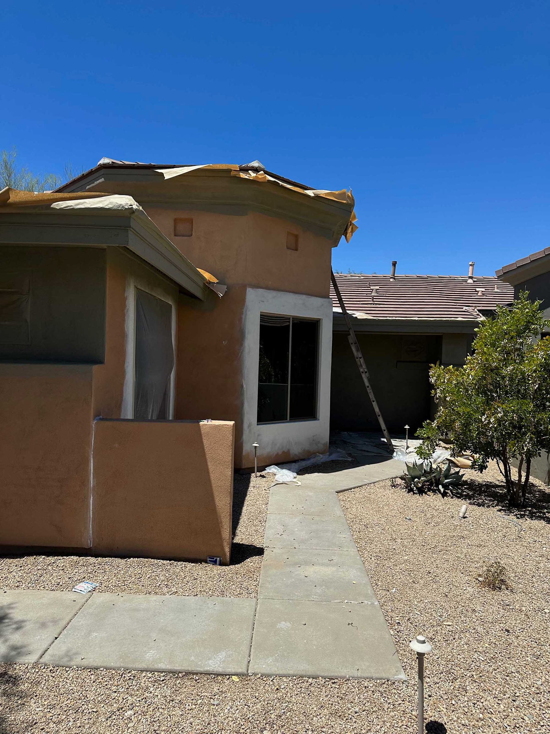 A house with a roof that has been damaged by a storm