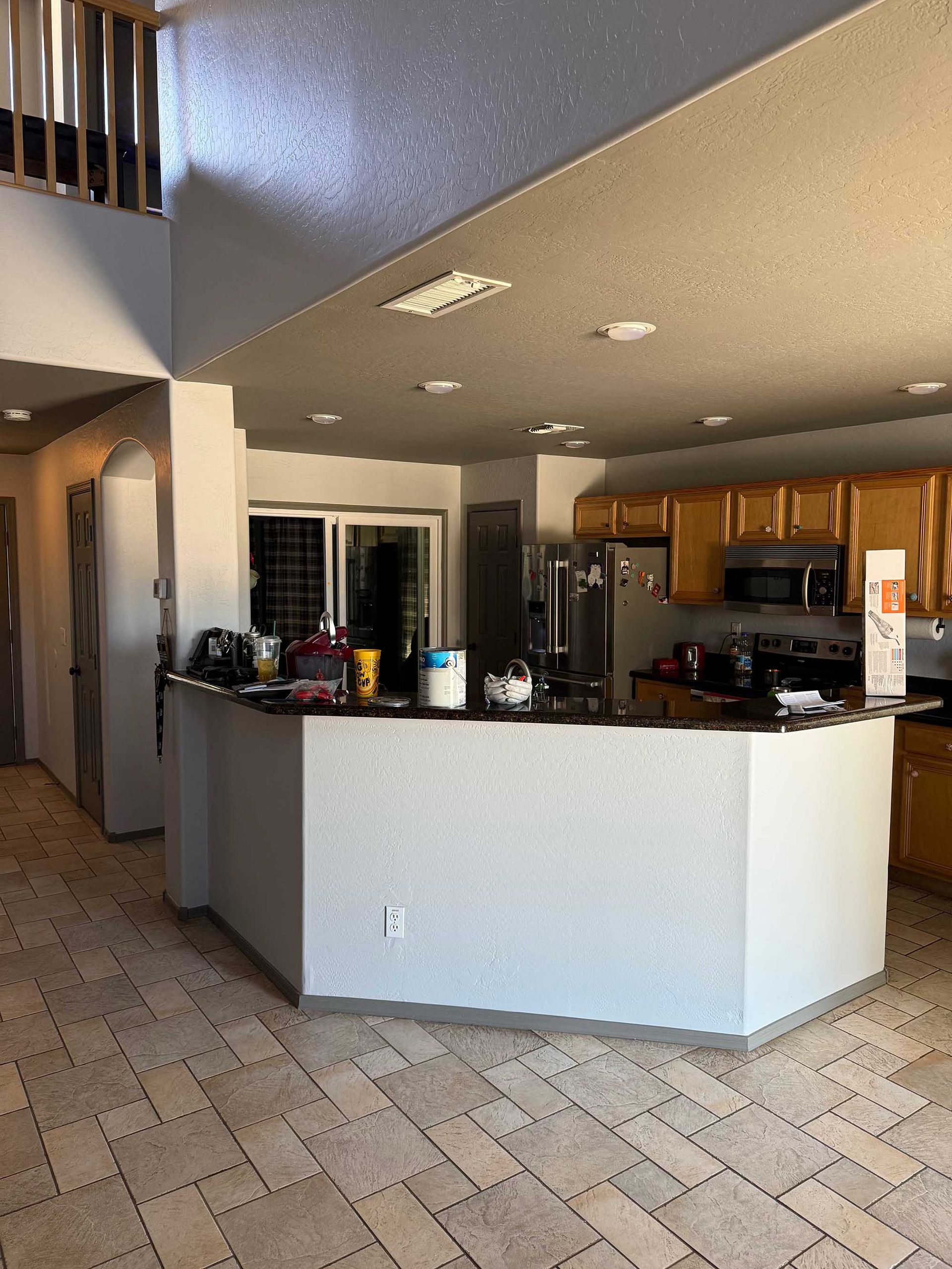 A kitchen with a large island in the middle of it