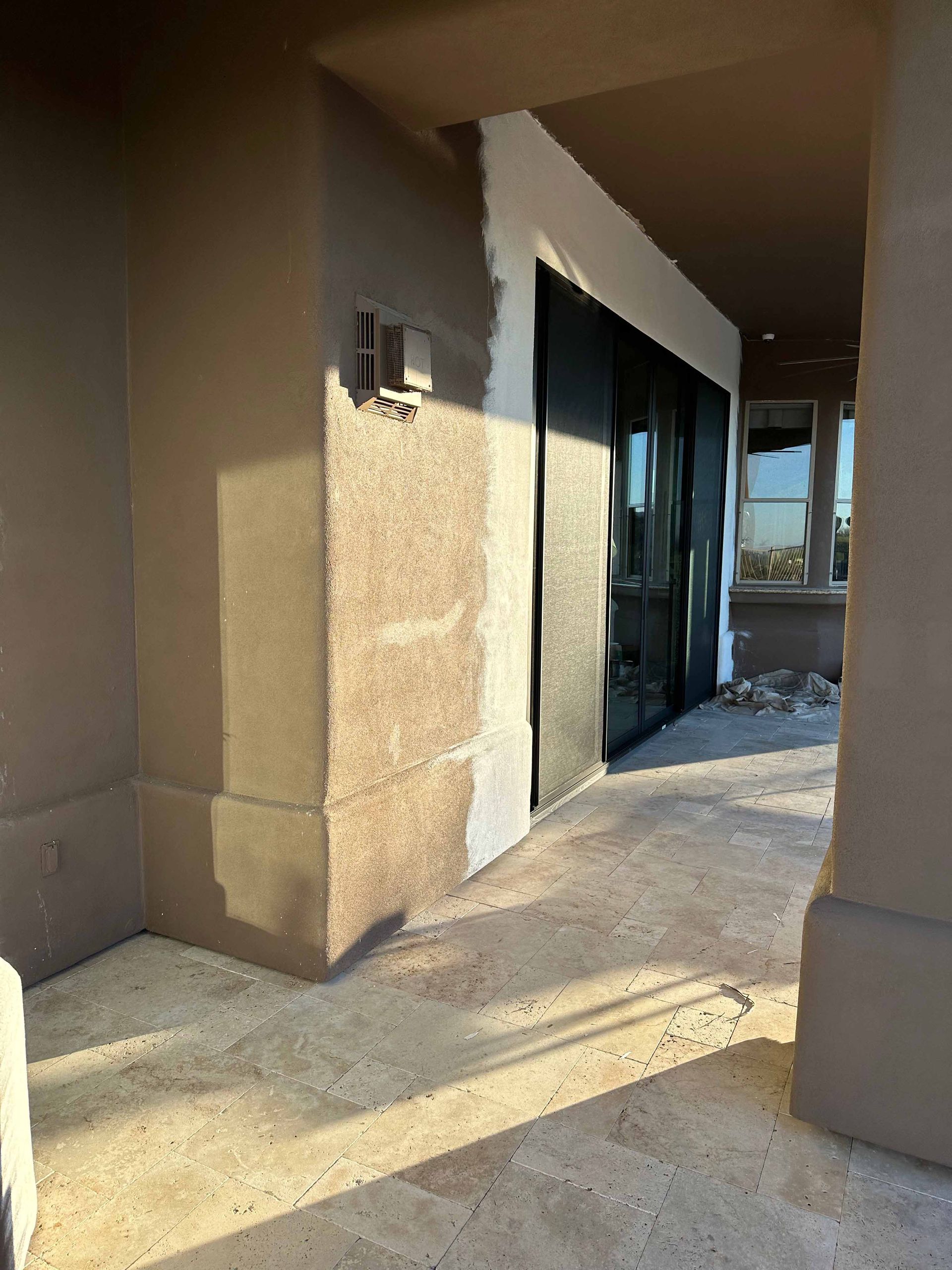 A building with a lot of windows is being painted white.