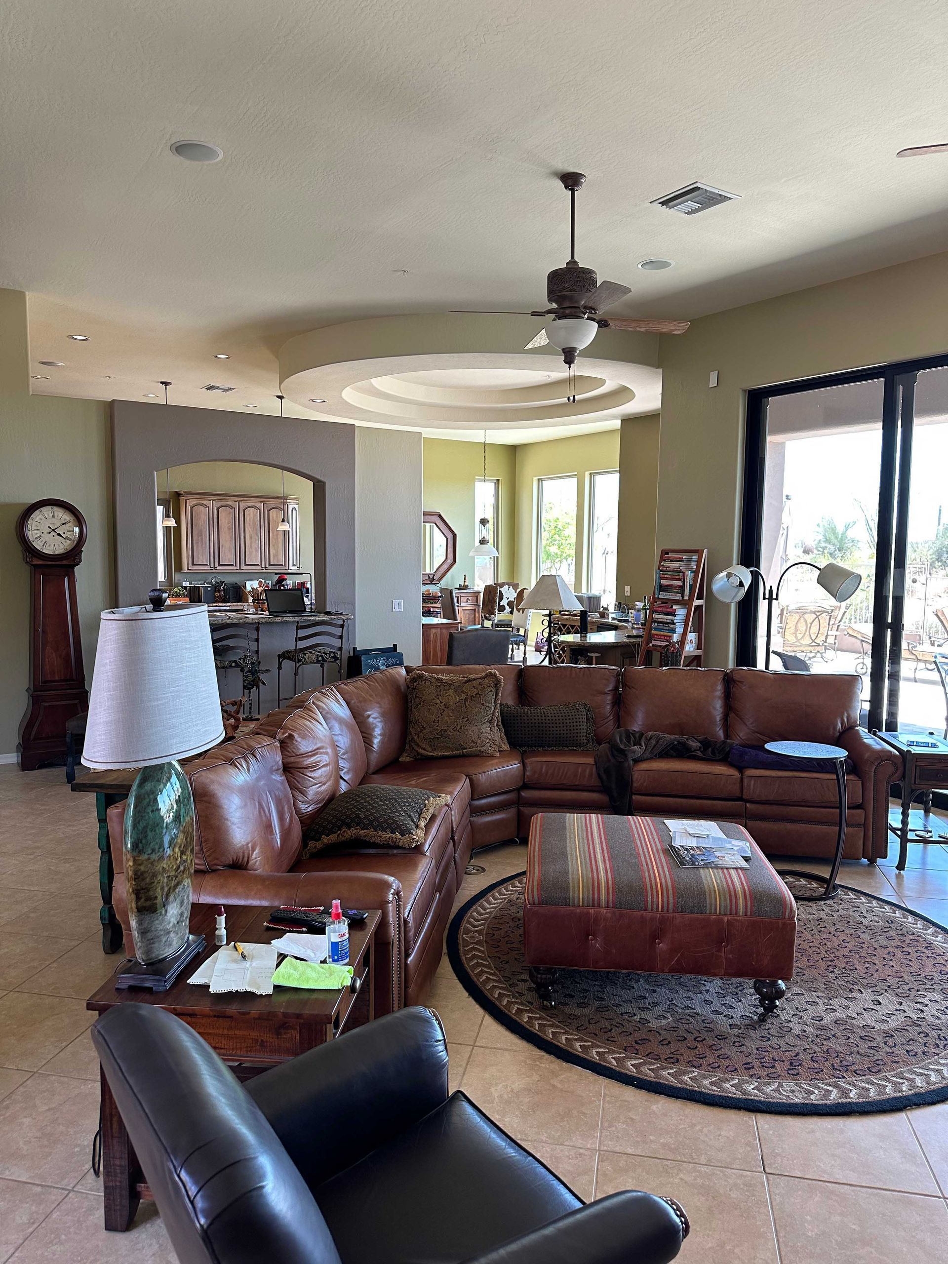A living room filled with furniture and a clock