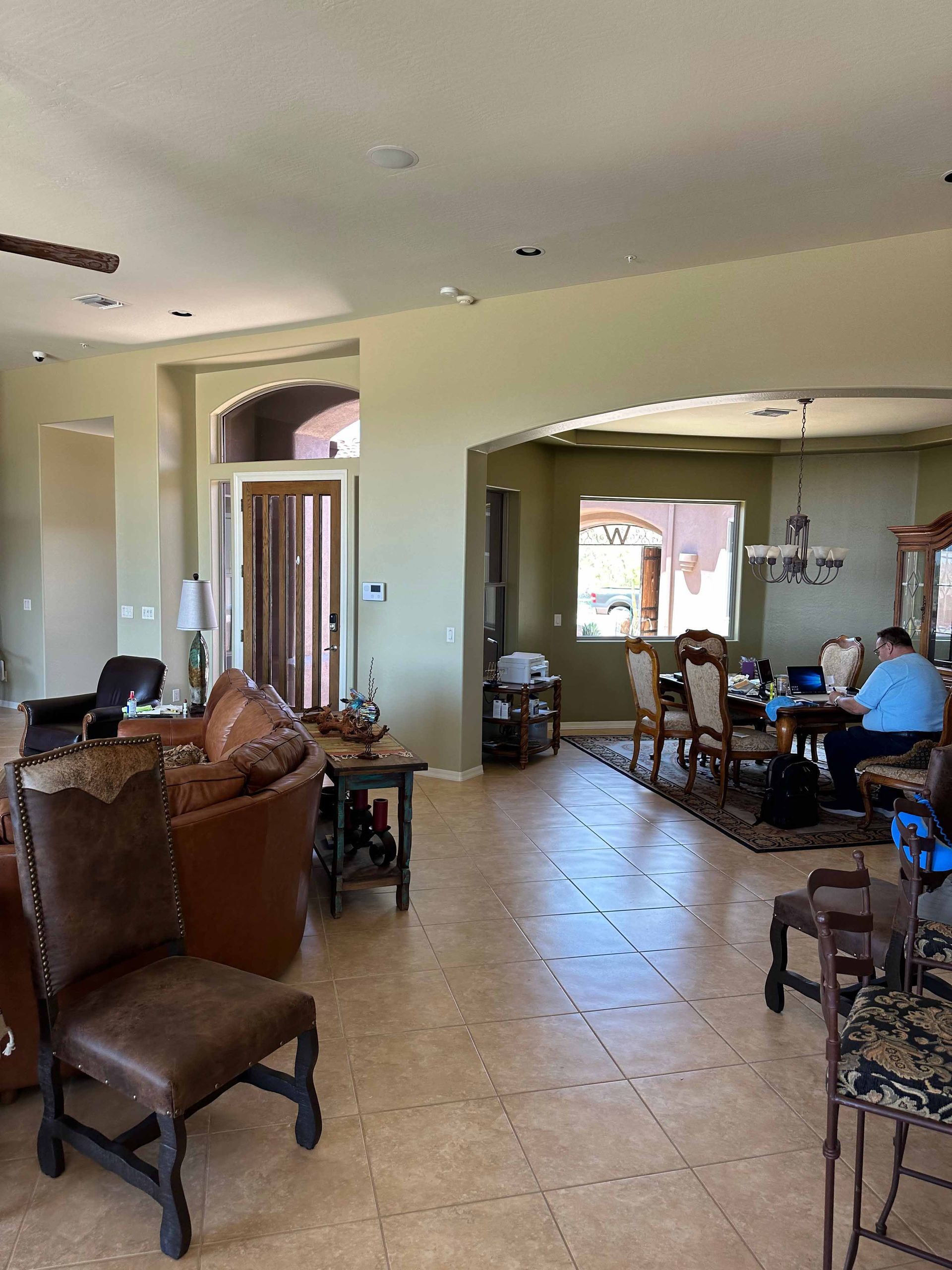 A living room filled with furniture and a dining room.