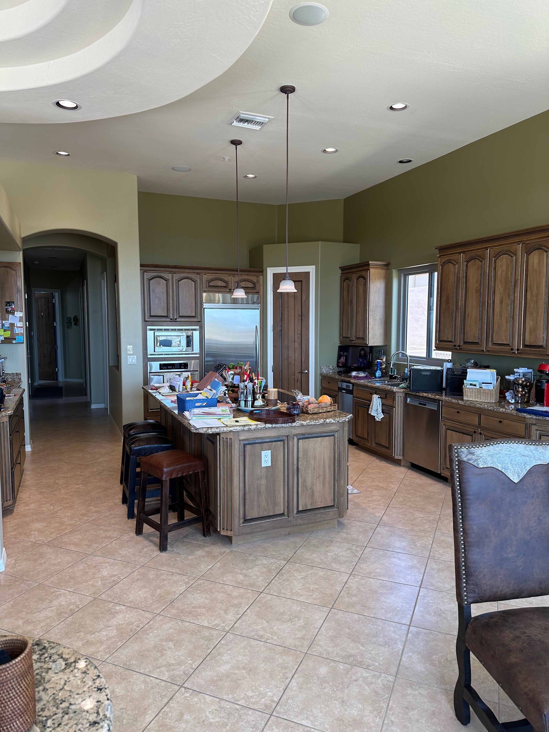 A kitchen with a large island in the middle of it