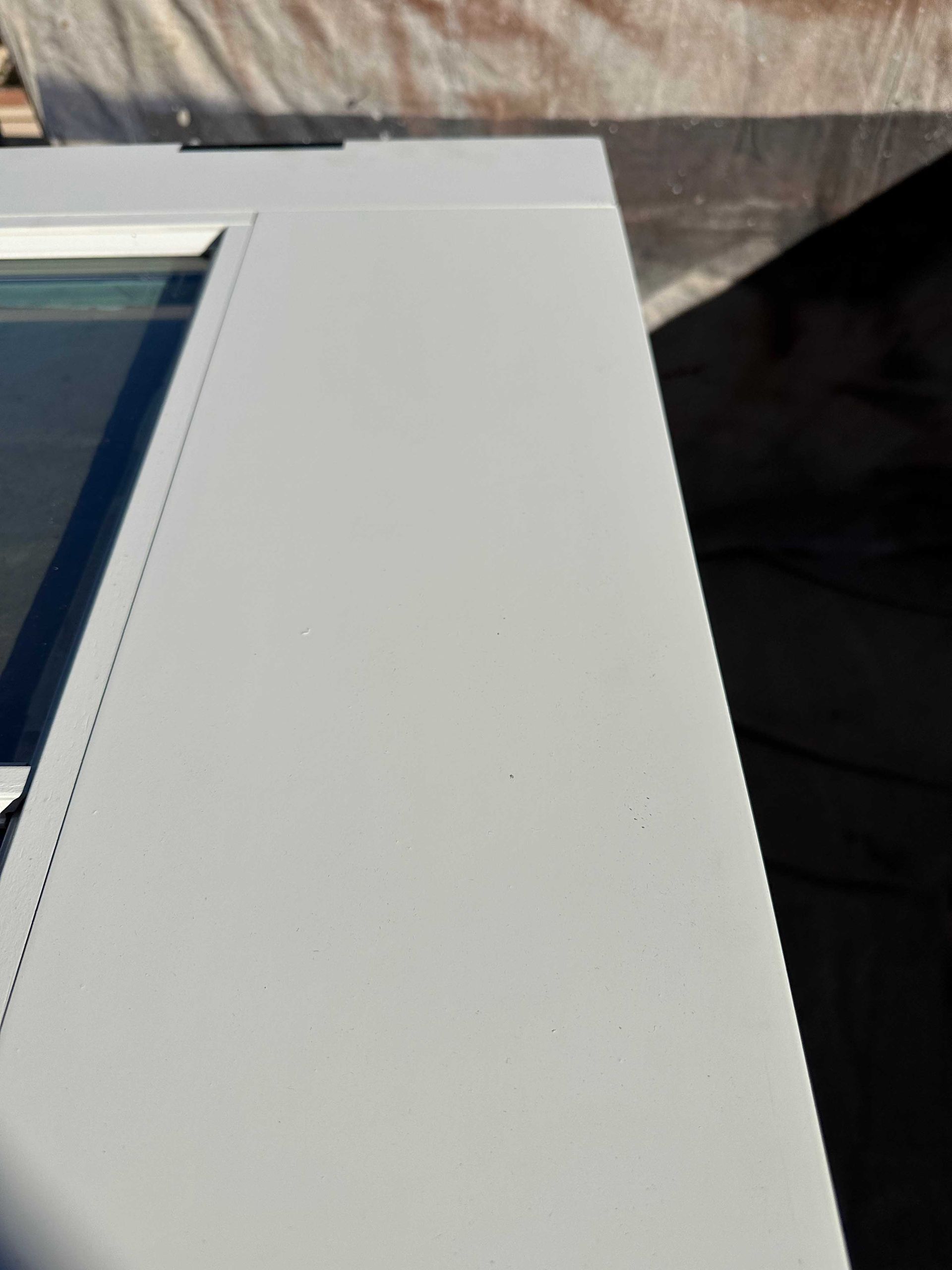 A close up of a white door with a window