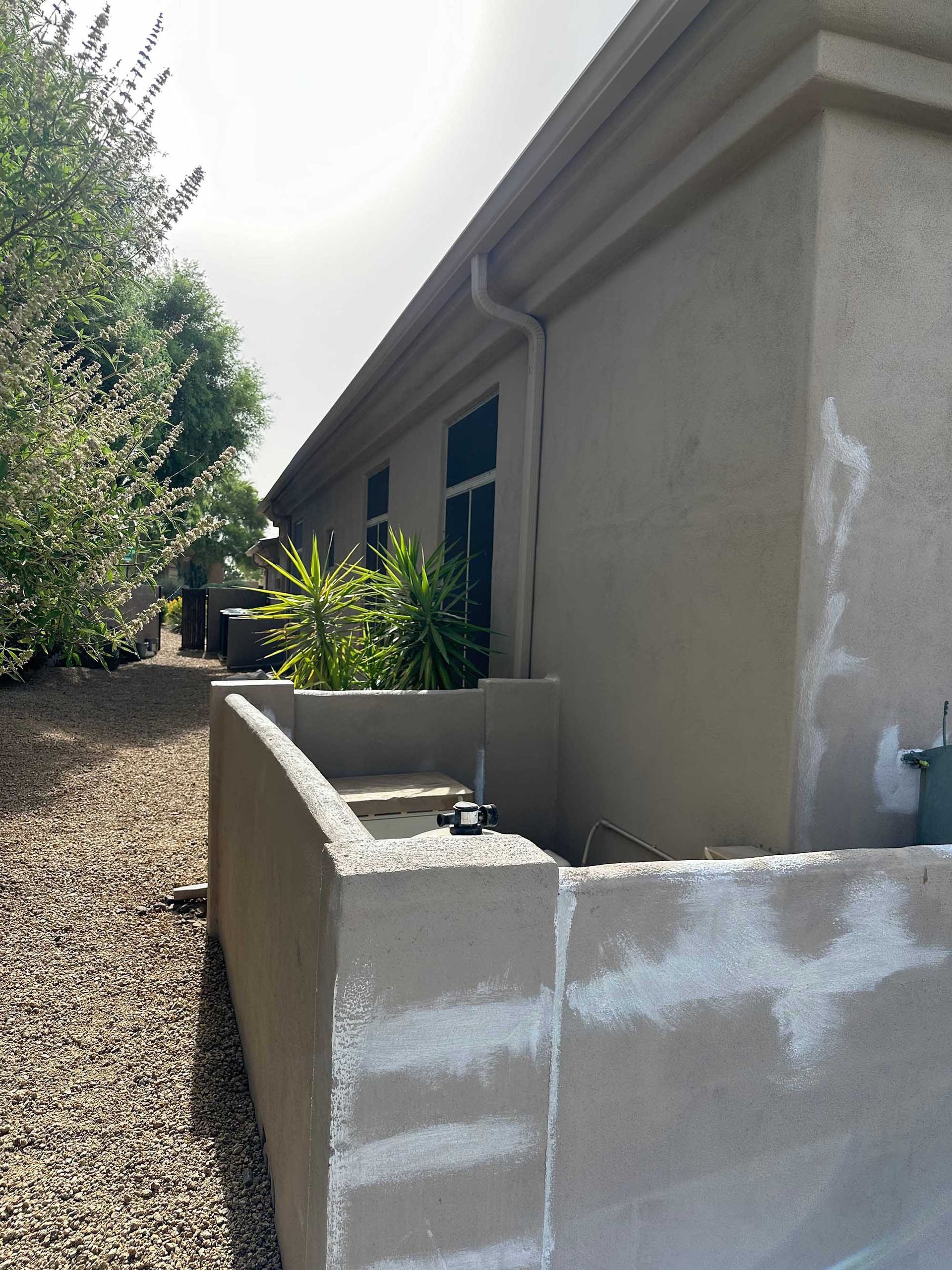 A house with a gutter on the side of it