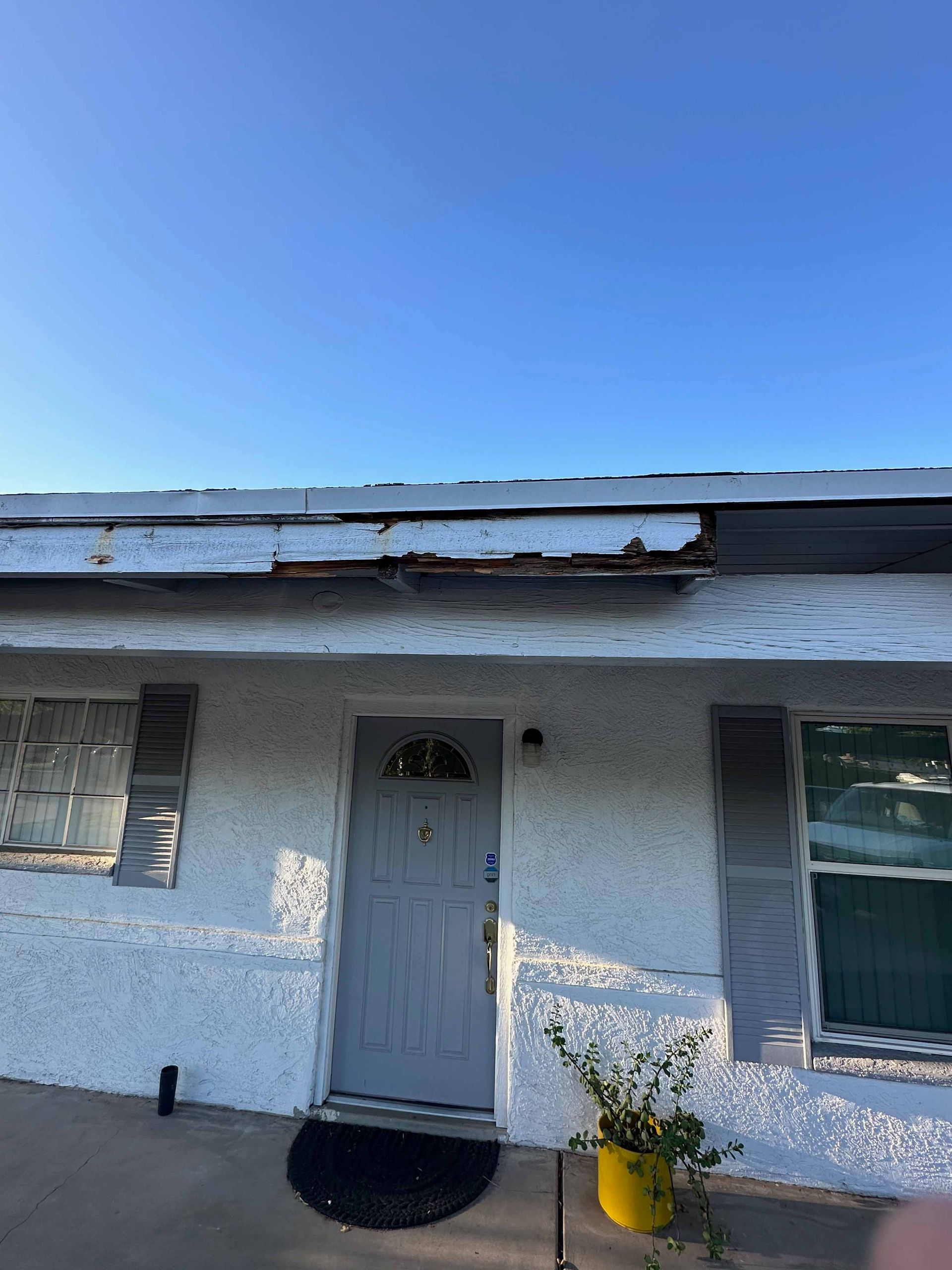 A white house with a blue sky in the background.