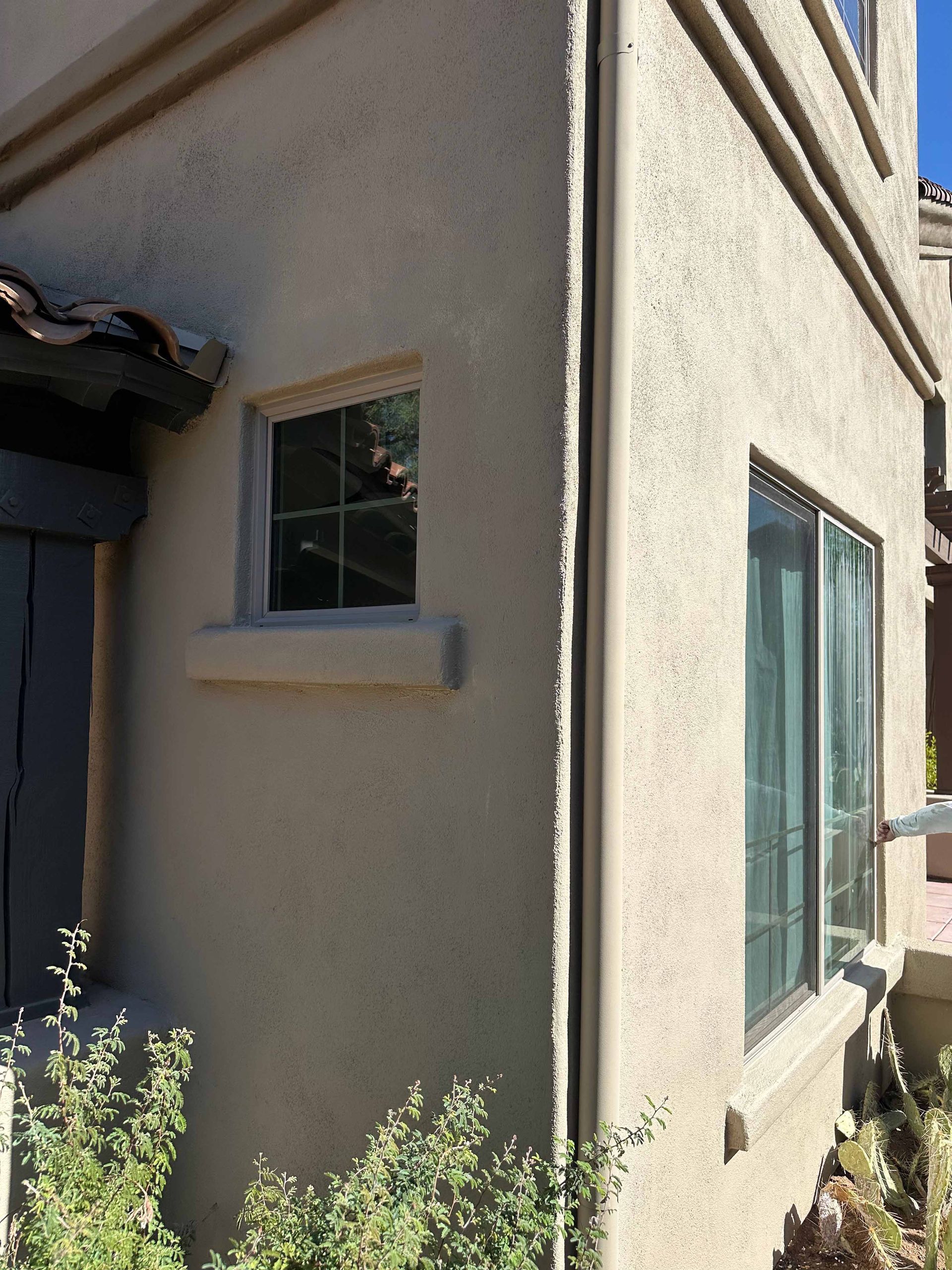 A house with a window on the side of it