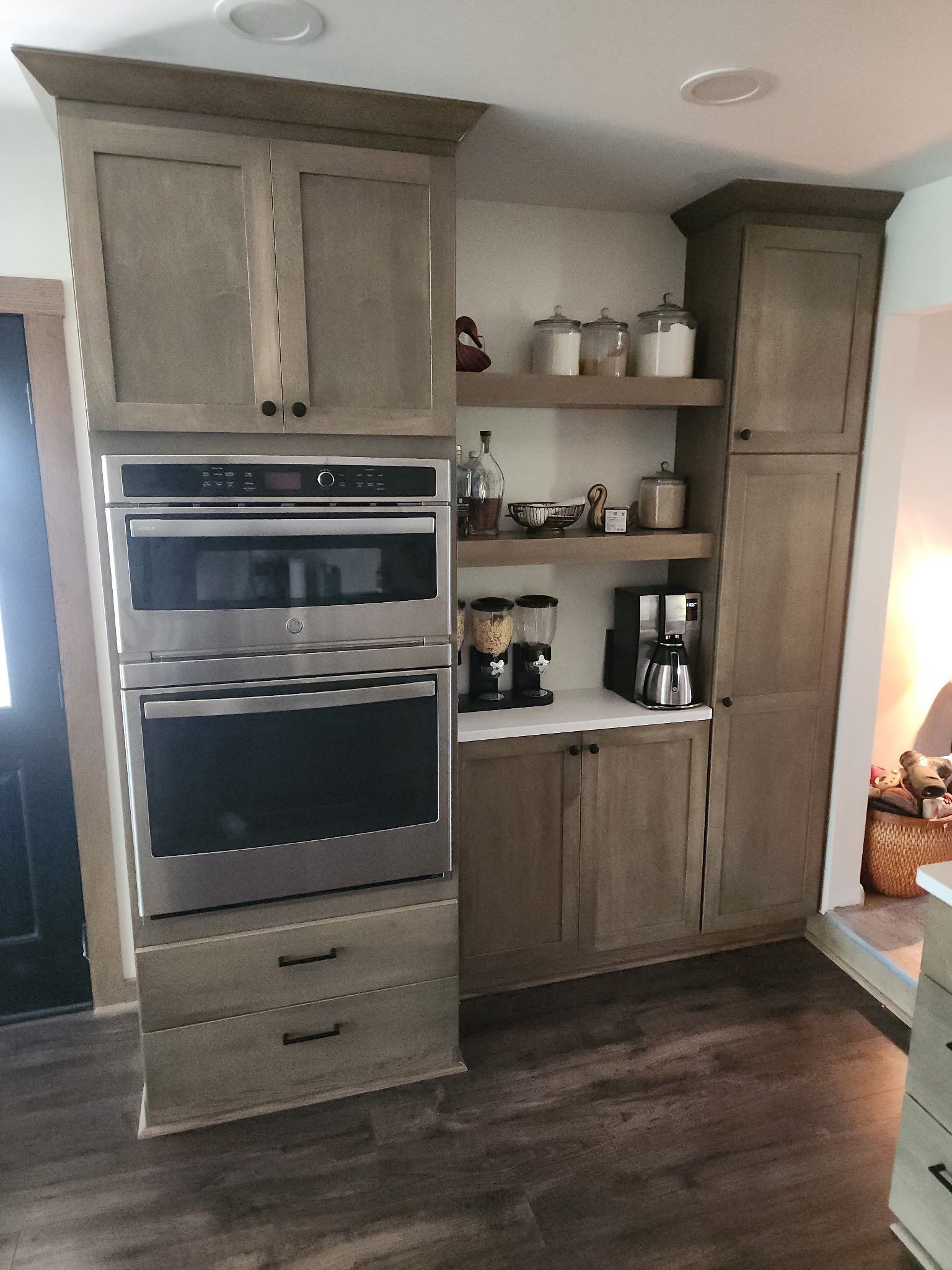A kitchen with stainless steel appliances and wooden cabinets