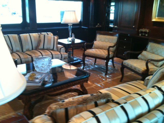 A living room filled with furniture and a lamp