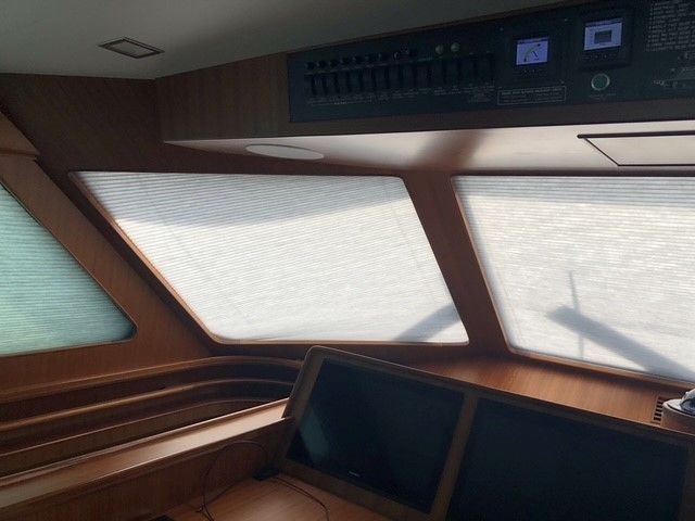 The inside of a boat with a lot of windows.