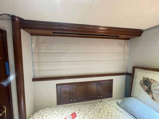 A room with a lot of windows and cabinets.