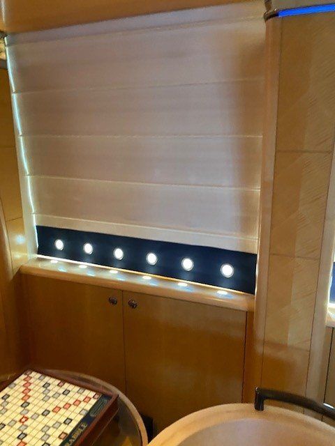 A room with a window and a table with a board game on it