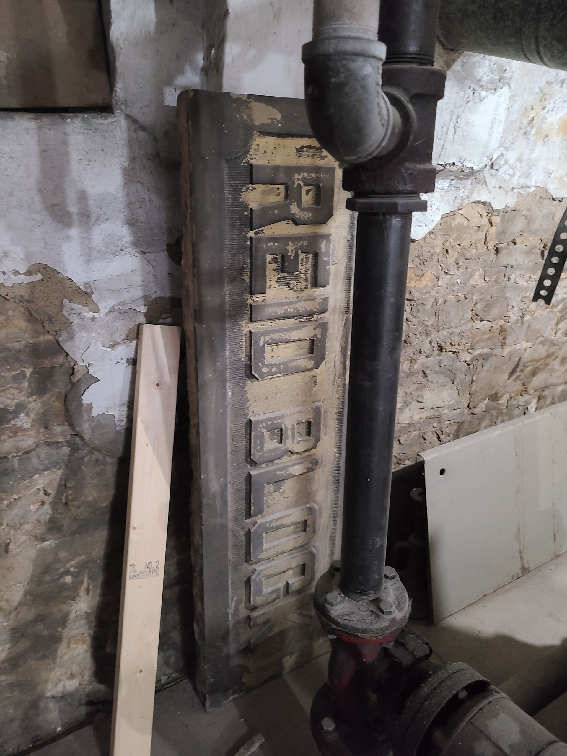 Old, weathered sign that reads 