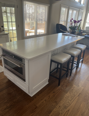 white countertop with chairs 