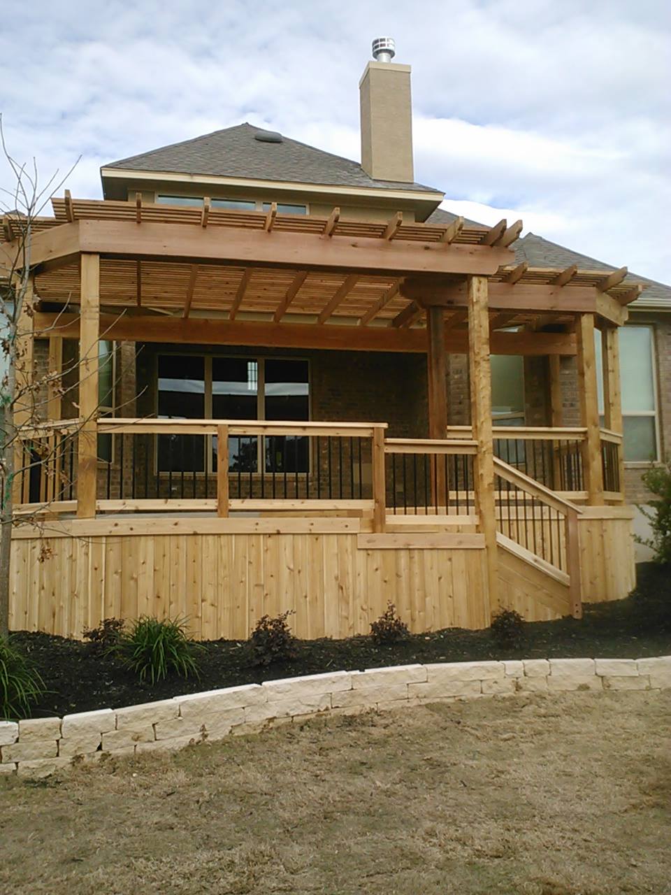A house with a wooden deck and stairs