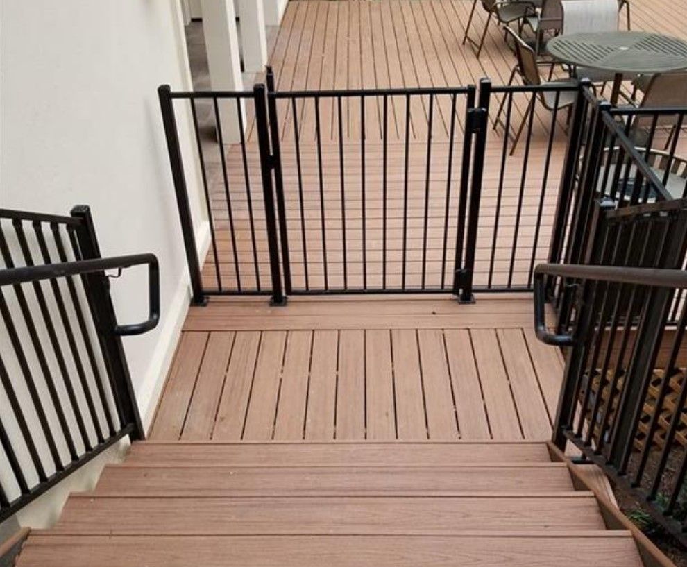 A wooden deck with stairs leading up to it