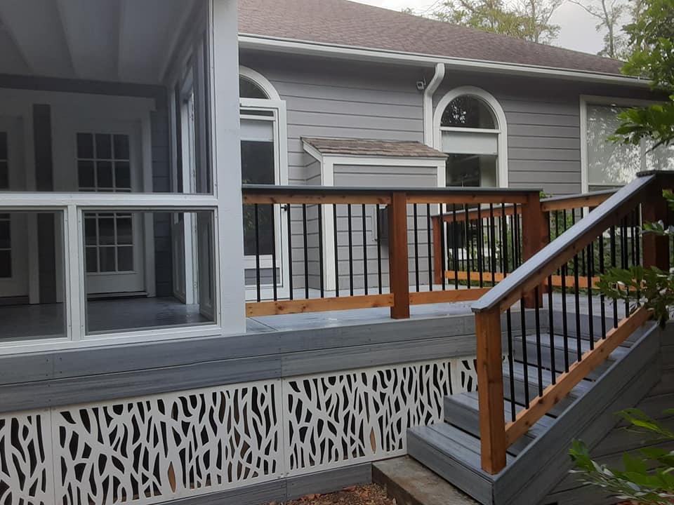 A house with a screened in porch and stairs