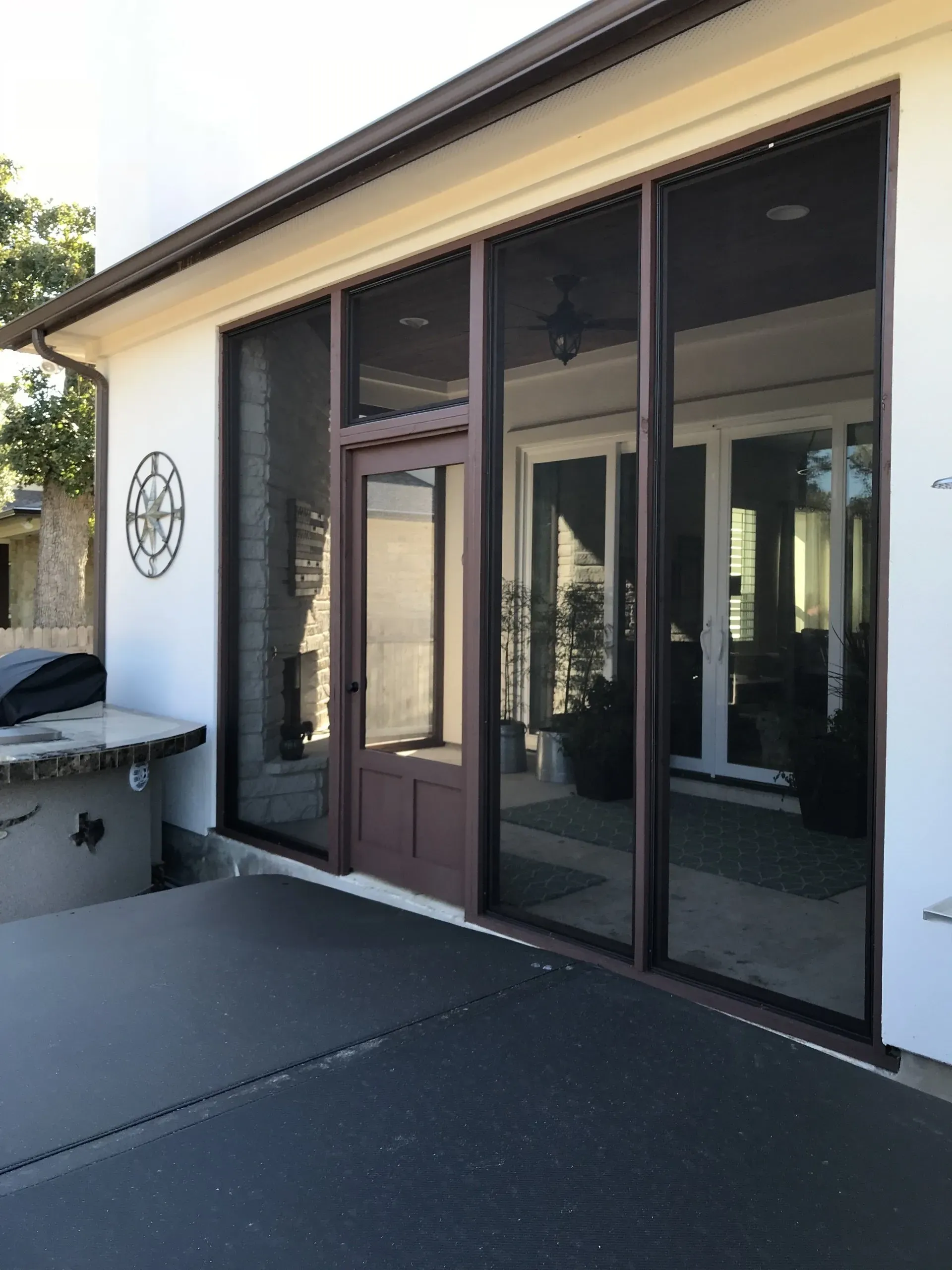A house with a lot of windows and a door