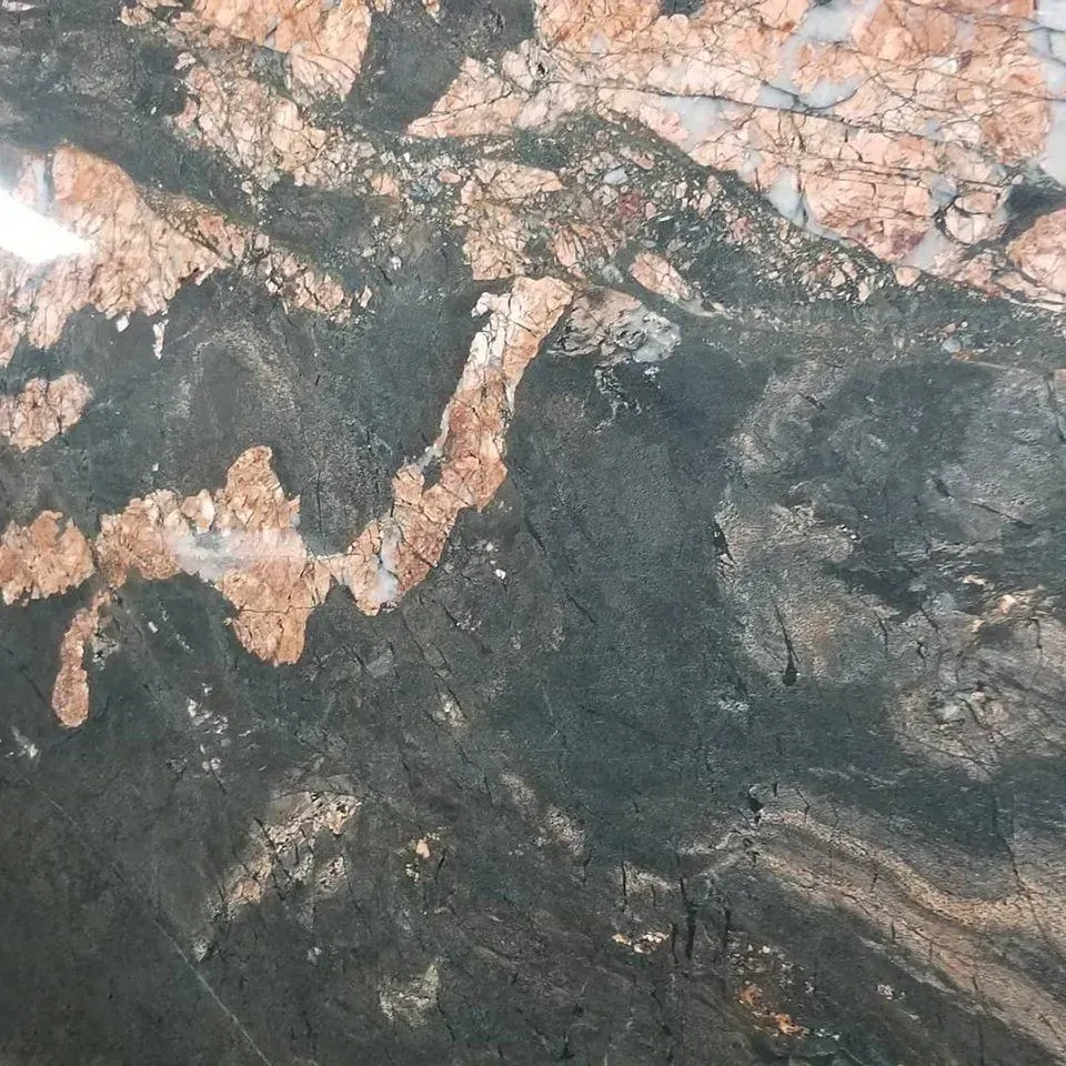 Dark gray and tan granite with swirling patterns.