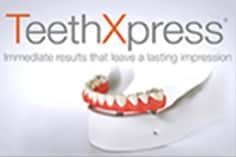 A picture of a teeth xpress machine with a picture of teeth on it.